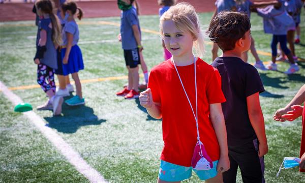 A girl gets ready to run